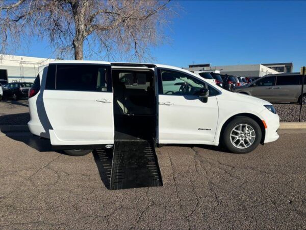 White Chrysler Voyager with Driverge Side Entry Automatic Fold Out conversion