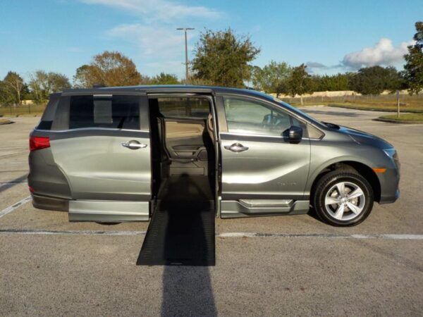 Green Honda Odyssey with BraunAbility Side Entry Automatic In Floor conversion