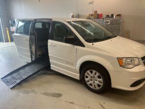 White Dodge Grand Caravan with BraunAbility Side Entry Automatic Fold Out conversion