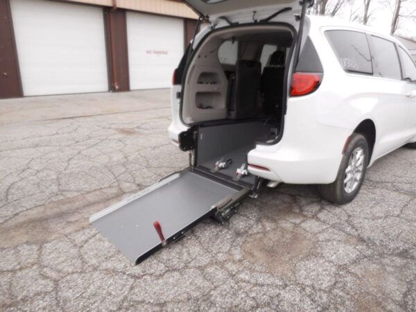 White Chrysler Voyager with Driverge Rear Entry Manual Fold Out conversion