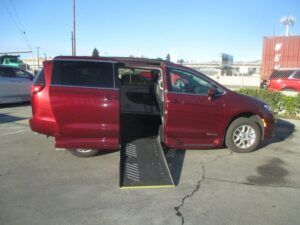 Red Chrysler Pacifica with Driverge Side Entry Automatic Fold Out conversion