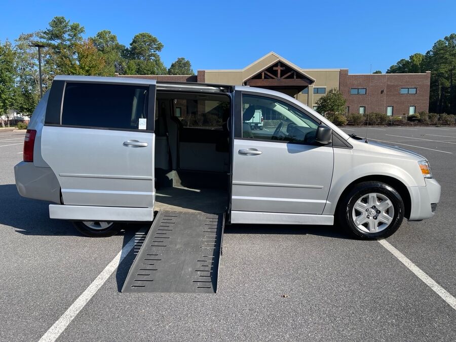 Silver Dodge Grand Caravan with Adaptive Vans Side Entry Automatic Fold Out conversion