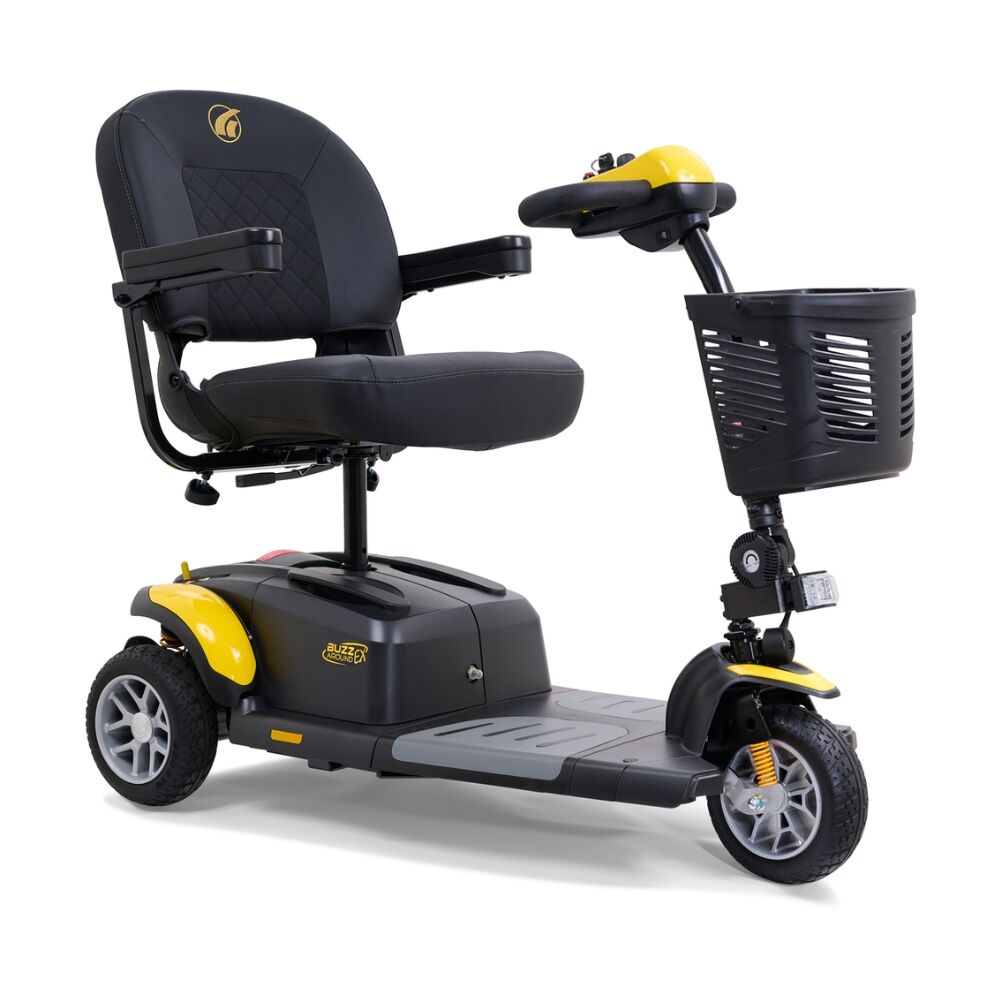The BuzzAround EX 3-Wheel Scooter is an electric mobility scooter with a black seat, armrests, front basket, and yellow accents, designed for personal transportation.