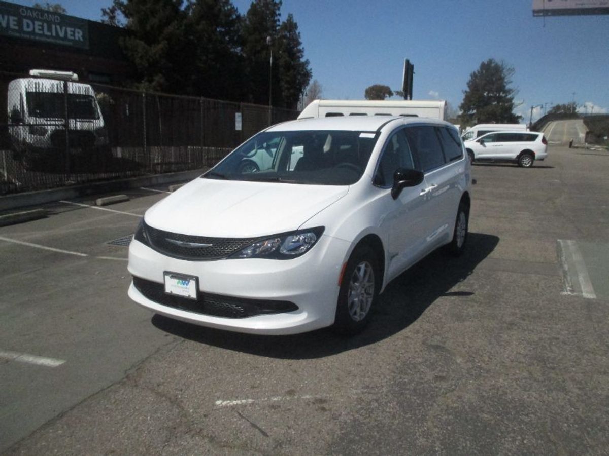 White Chrysler Voyager with Driverge Side Entry Automatic Fold Out conversion