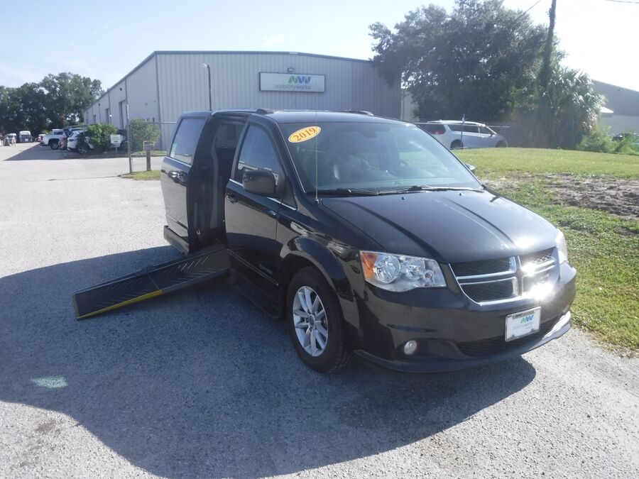 Black Dodge Grand Caravan with Driverge Side Entry Automatic Fold Out conversion