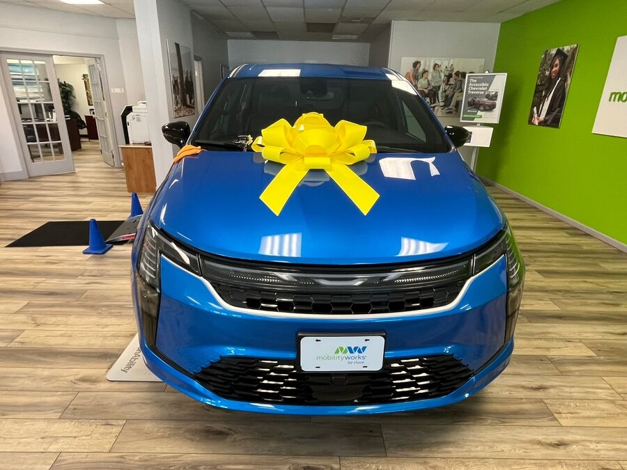 Blue Chrysler Pacifica with Driverge Side Entry Automatic Fold Out conversion