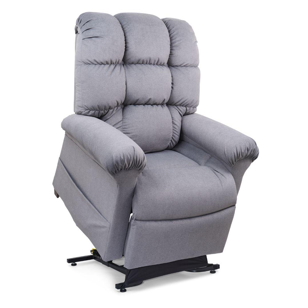 The Cloud Lift Chair is a gray upholstered recliner inspired by the EZ Sleeper with Twilight, featuring padded armrests and backrest, set on a partially elevated mechanical base for enhanced comfort.