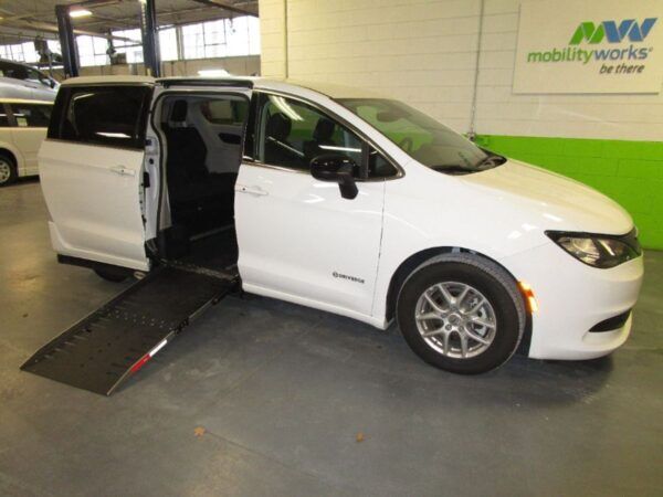 White Chrysler Voyager with Driverge Side Entry Automatic Fold Out conversion