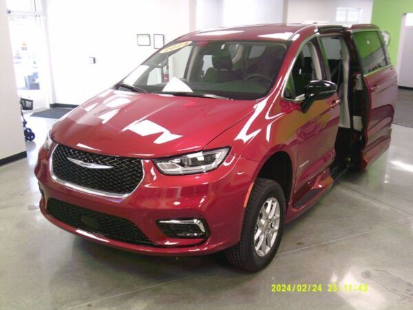 Red Chrysler Pacifica with Driverge Side Entry Automatic Fold Out conversion