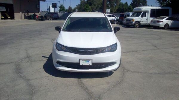 White Chrysler Voyager with Driverge Side Entry Automatic Fold Out conversion