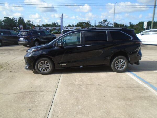 Black Toyota Sienna with Driverge Rear Entry Manual Fold Out conversion