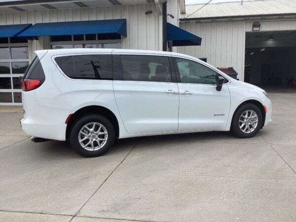 White Chrysler Voyager with Driverge Rear Entry Manual Fold Out conversion