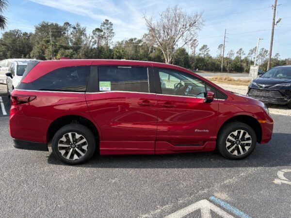 Red Honda Odyssey with BraunAbility Side Entry Automatic In Floor conversion