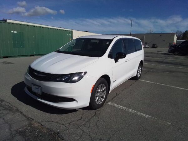 White Chrysler Voyager with Driverge Side Entry Automatic Fold Out conversion