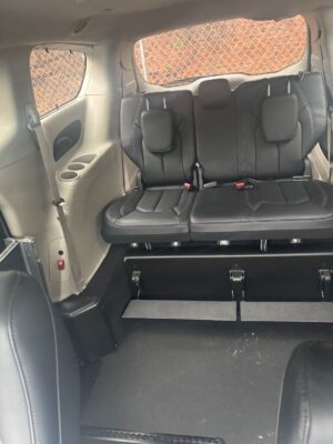White Chrysler Pacifica with Driverge Side Entry Automatic Fold Out conversion