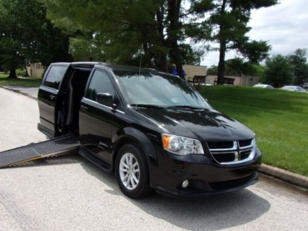 Black Dodge Grand Caravan with Driverge Side Entry Automatic Fold Out conversion