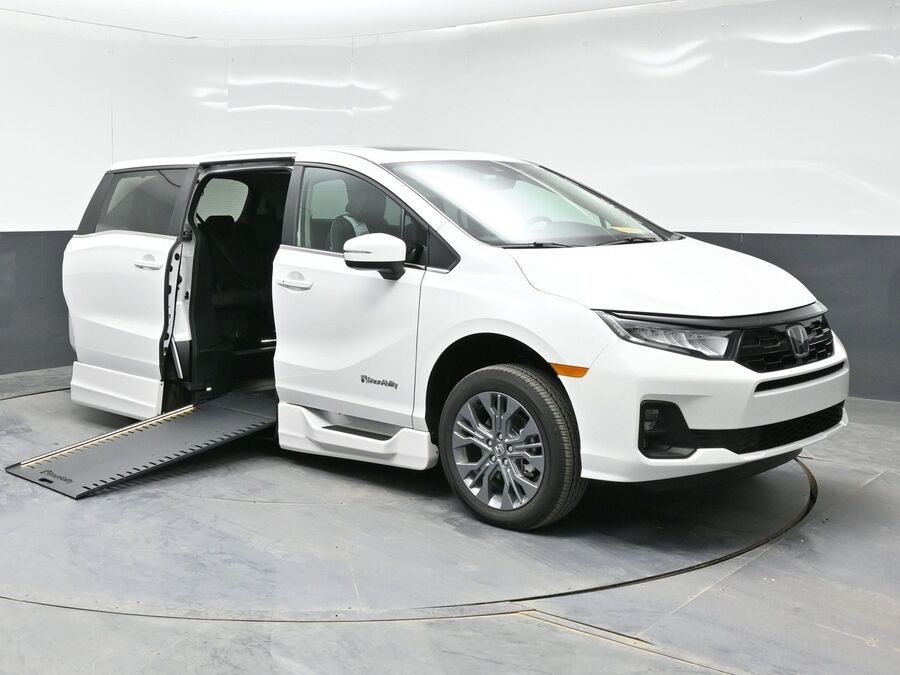 White Honda Odyssey with BraunAbility Side Entry Automatic In Floor conversion