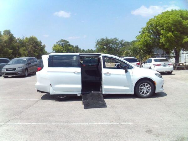 White Chrysler Voyager with Driverge Side Entry Automatic Fold Out conversion