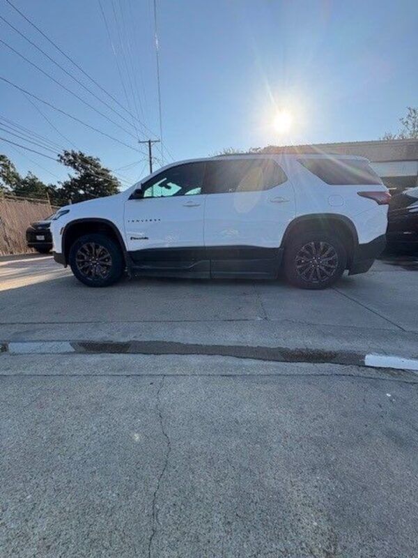 White Chevrolet Traverse with BraunAbility Side Entry Automatic In Floor conversion