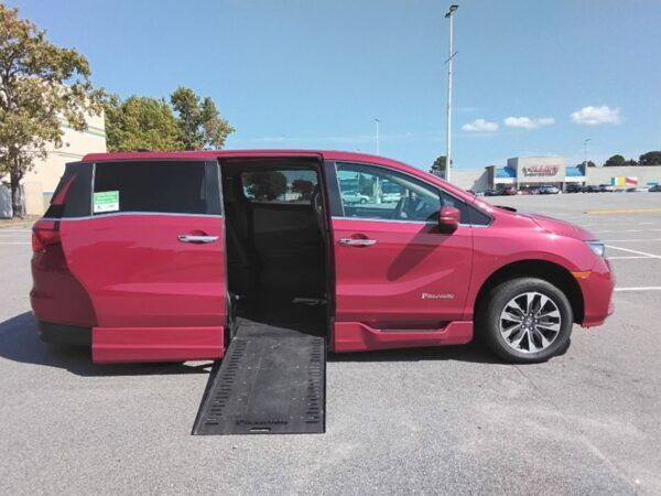 Red Honda Odyssey with BraunAbility Side Entry Automatic In Floor conversion