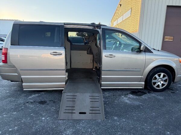 Gold Chrysler Town and Country with BraunAbility Side Entry Automatic Fold Out conversion