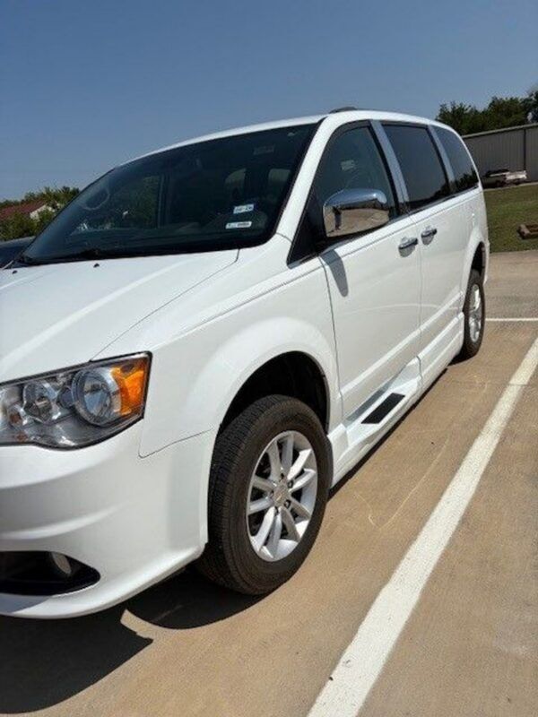 White Dodge Grand Caravan with BraunAbility Side Entry Automatic Fold Out conversion