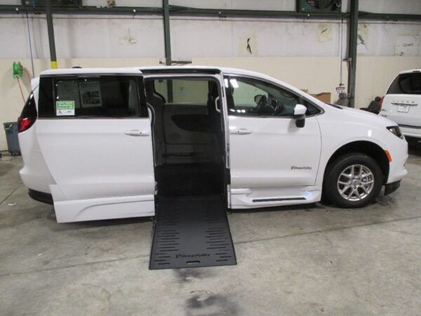 White Chrysler Voyager with BraunAbility Side Entry Automatic Fold Out conversion