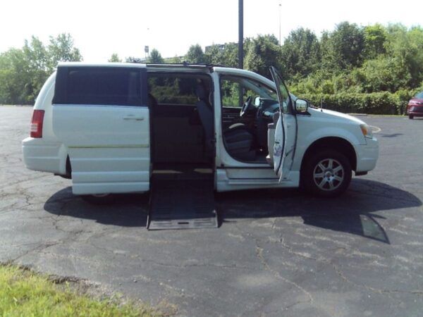 White Chrysler Town and Country with BraunAbility Side Entry Automatic Fold Out conversion