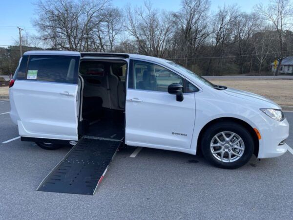 White Chrysler Voyager with Driverge Side Entry Automatic Fold Out conversion